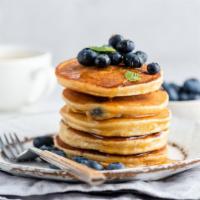 Blueberry Pancakes · Served with 3 buttery pancakes cooked to perfection and topped with fresh blueberries.