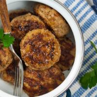 Side Of Sausage Patties · A side dish containing perfectly cooked Sausage Patties.