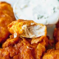 Buffalo Chicken Strips · Crispy buffalo chicken strips served with blue cheese or ranch dressing.