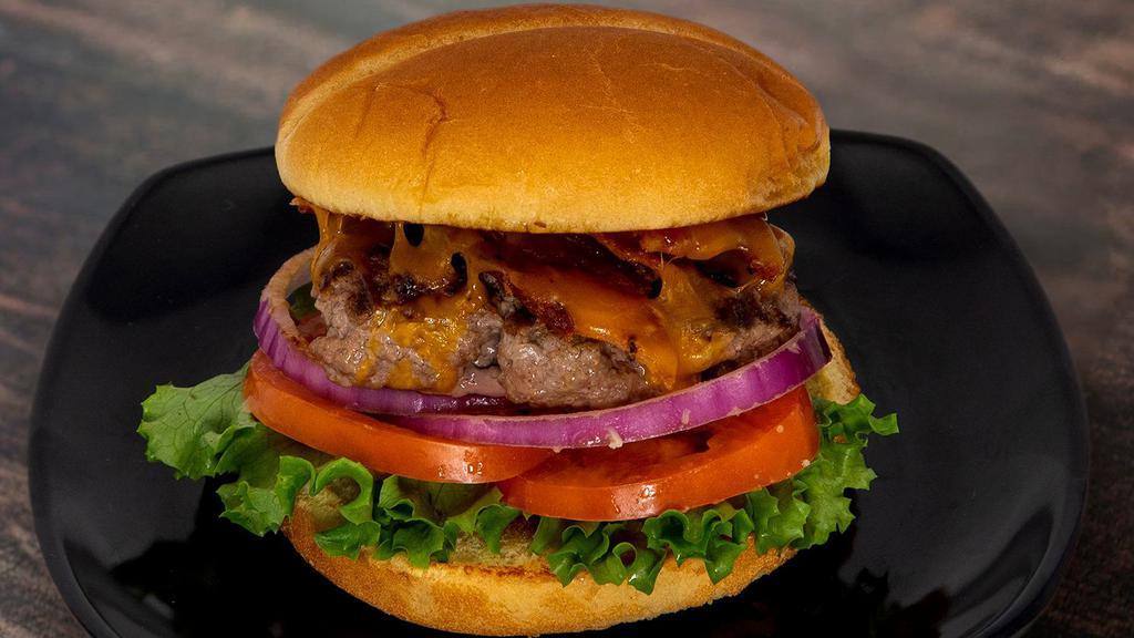 Bacon Cheddar Burger · Half pound of angus beef, cheddar cheese, bacon, lettuce, tomato, and grilled red onion on a bun.