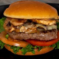 Mushroom Swiss Burger · Half pound angus beef, swiss cheese, mushrooms, lettuce, tomato, and mayo on a bun.