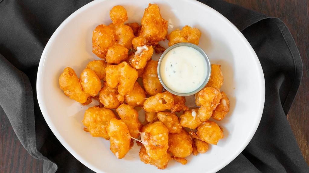 Whiskey Battered Cheese Curds · Top secret whiskey battered white cheddar cheese curds, choice of dipping sauce dipping sauces: ranch or marinara.