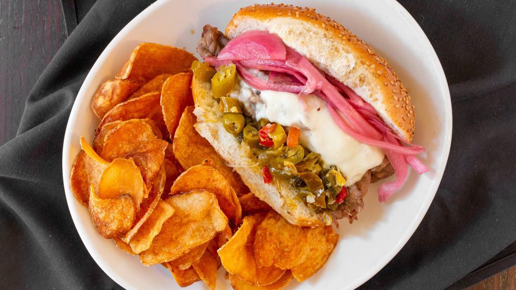 Italian Beef Sandwich · Slow roasted Italian beef, mozzarella, giardiniera relish, pickled red onion, served with side of au jus on a Sciortino's Italian roll.
