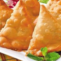 Vegetable Samosa · Vegetable in a flaky pastry served with a crispy salad.