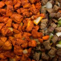 Tandoori Mix Grill · Consisting of marinated chicken on the bone, chicken tikka, shish kebab and king prawns.