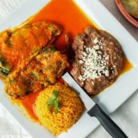 Chille Relleno (2) · Two stuffed poblano peppers with queso fresco, served with mild spicy red salsa, with rice, ...