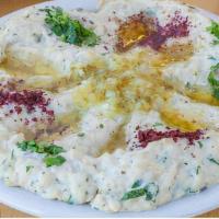 Baba Ghanouj · Baked eggplant blended with tahini sauce & lemon, served with pita bread.