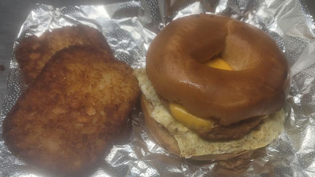 Breakfast Bagels Sandwiches Combo · choice your bagels , 2 egg, cheese and your choice of meat served with hash brown or grits