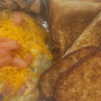 Veggie Omelet · 3 eggs cheese, red pepper, green peppers, onions, mushrooms, spinach grits or hash browns an...
