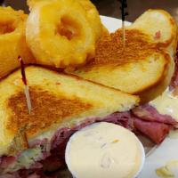 Reuben · Corned beef with sauerkraut, Swiss cheese and Russian dressing on grilled rye.