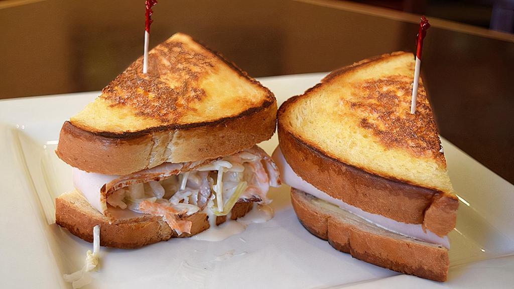 Cabbie · Turkey, Coleslaw, Russian dressing and Swiss cheese on grilled rye.