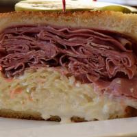 Special · Your choice of corned beef or roast beef, Swiss cheese, coleslaw and Russian dressing on gri...