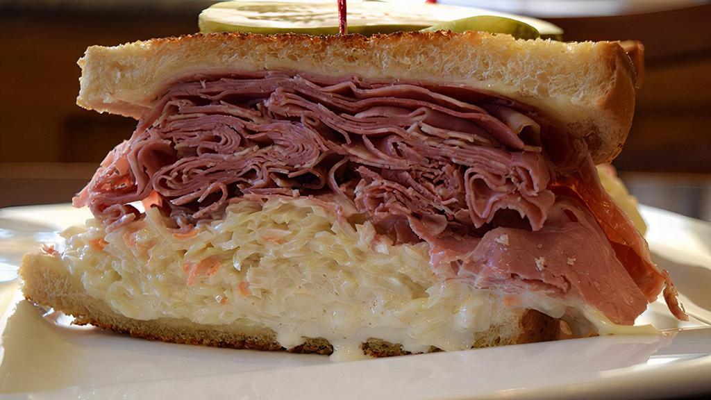 Special · Your choice of corned beef or roast beef, Swiss cheese, coleslaw and Russian dressing on grilled rye.