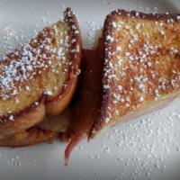 French Toast · Thick cut bread dipped in our house made batter, then grilled.
