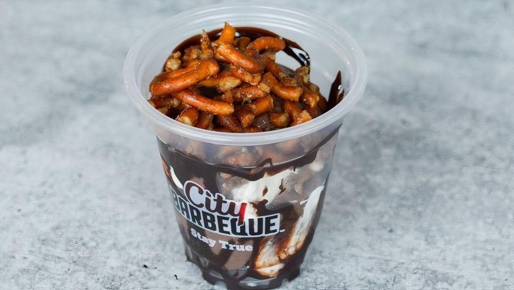 Salted Pretzel S’Mores Pudding · Creamy, chocolatey pudding loaded with mini chocolate chips, marshmallow whip, chocolate sauce, and salted pretzel crumble