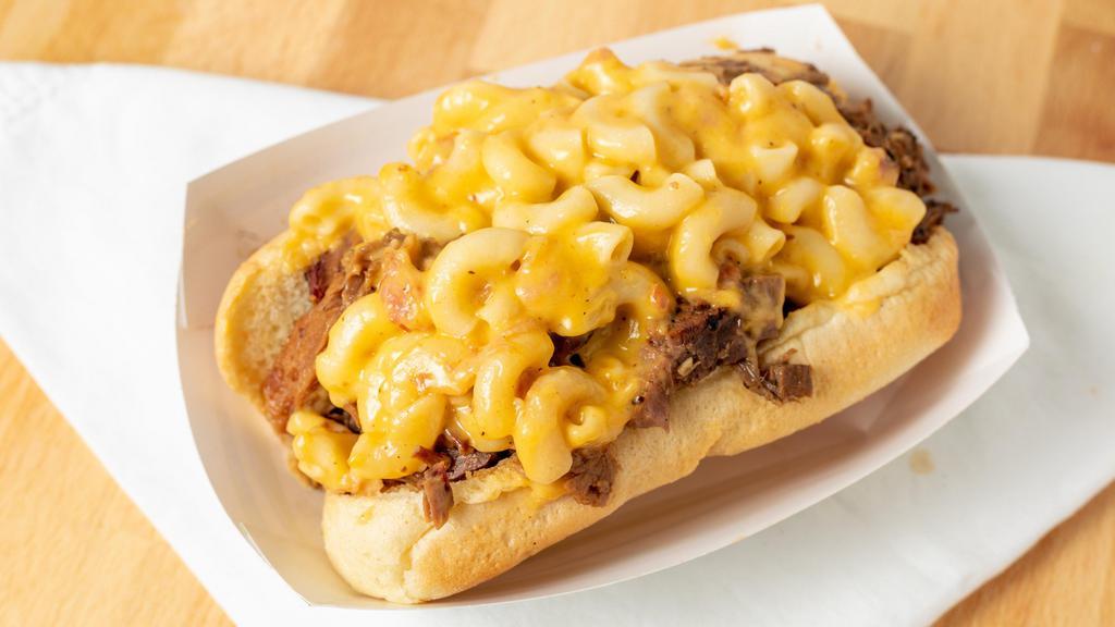The Cadillac · Brisket, pilled pork, and BBQ mac & cheese piled high on one sandwich.
