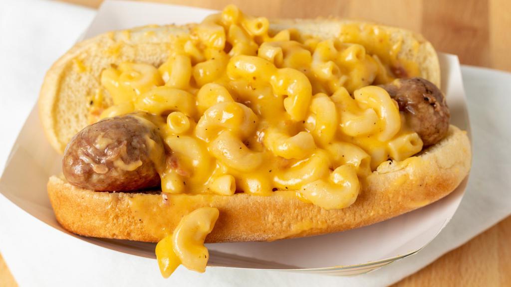 Ruckus Dog · Handmade smoked Italian sausage topped with BBQ mac & cheese .