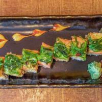 S. Red Dragon Roll (8 Pieces) · Smoke eel, avocado, inside, spicy tuna, seaweed salad on top.