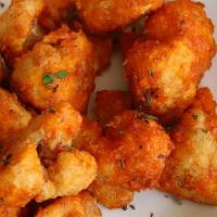 Buffalo Cauliflower · Crispy fried bites of cauliflower tossed in your choice of sauce. Served with celery and ran...