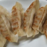 Gyoza · Pan fried pork dumplings.