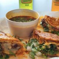 Taco Birria · Soft corn tortilla, onion, cilantro and chesse