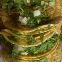 Taco Barbacoa / Steam Shredded Beef · Soft corn tortilla stuffed, with cilantro and onion, served with salsa and lemon