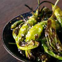 Blistered Shishitos · Shishito peppers blistered and tossed with citrus and sesame