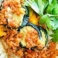 Cauliflower Rice Bowl · Vegetarian. Riced cauliflower, sun dried tomato pesto, roast vegetable blend. Pita chips for...