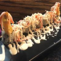 Coconut Roll · Shrimp tempura and avocado topped with crabmeat, coconut flake, and coconut sauce.