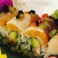 Amazing Roll · Alaska King crab, avocado topped with spicy salmon, fresh tuna, white tuna, yellowtail and c...