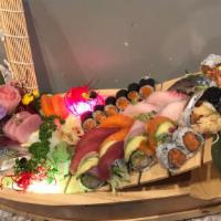 Love Boat · 12 pieces of sushi, 15 pieces of sashimi, California roll and miso house roll. Served with t...