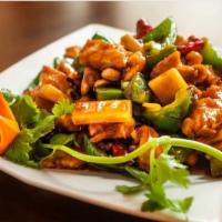 Kung Po Delight · Hot and spicy. Shrimp and chicken stir fried with a rich brown sauce with green pepper and p...