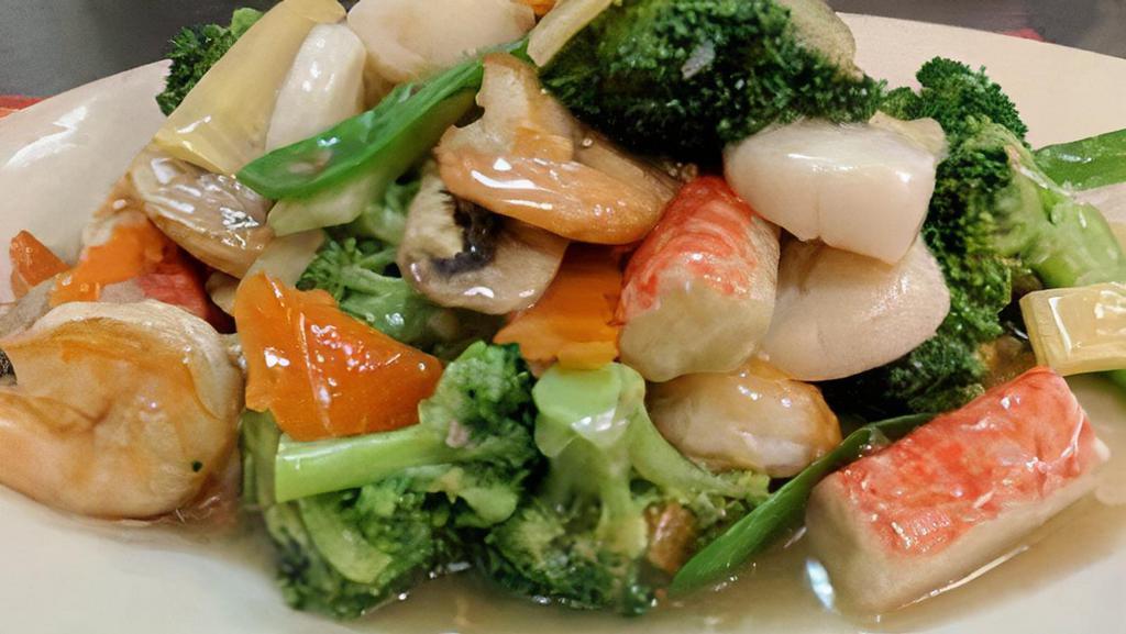 Seafood Combination · Jumbo shrimp, fresh scallop, and crab meat with assorted vegetables in white sauce.