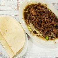 House Moo Shu Pork · Stirred fried shredded pork on a bed of bean sprouts served with plum sauce and moo shu panc...