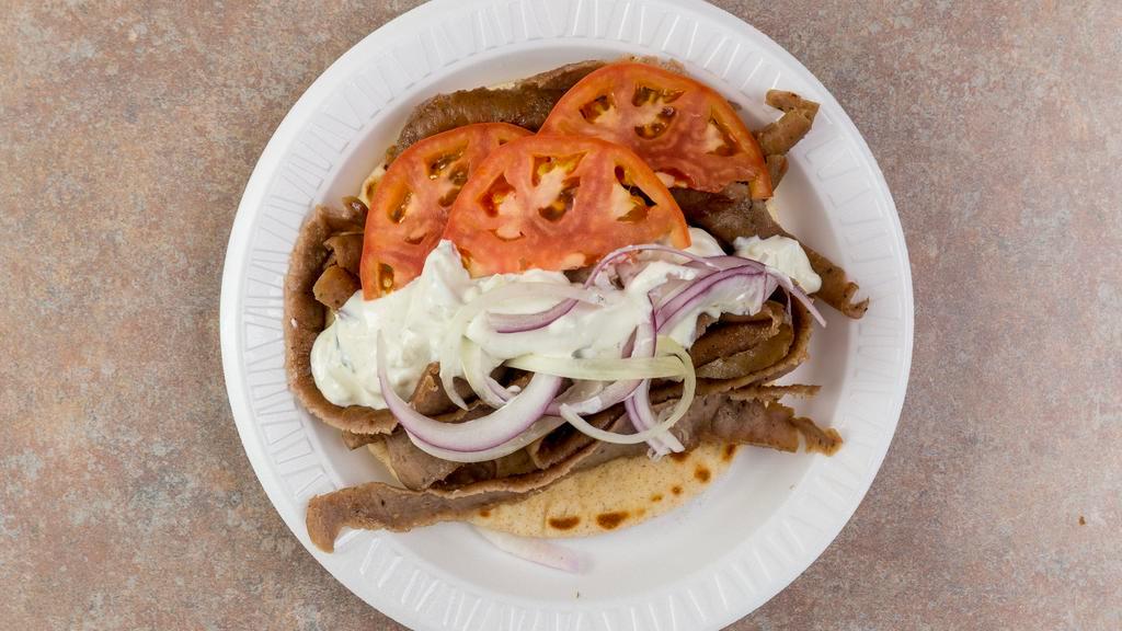 *Gyro Plate · Served with onion, tomato, sauce on the side, fries, pita.