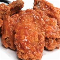 Wings · Plump, juicy chicken wings tossed in original or hot sauce. Served with Buddy’s Original Ble...