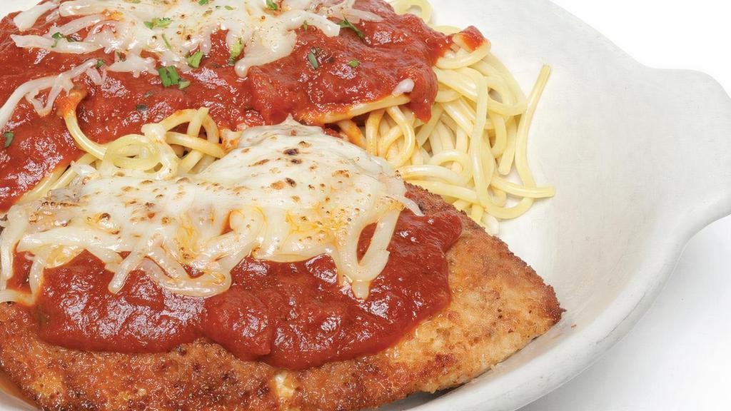 Oven-Baked Chicken Parmesan · Grilled chicken breast rolled in seasoned breadcrumbs and baked with mozzarella cheese.  Served on spaghetti with your choice of marinara or meat sauce.