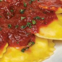 Cheese Ravioli · Classic pasta pillows filled with a four cheese blend.  Served with your choice of meat or m...
