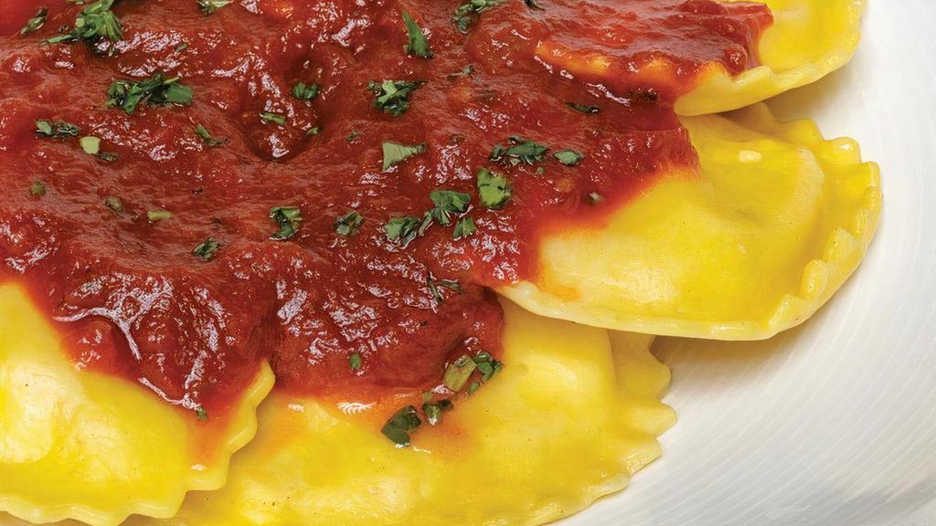 Cheese Ravioli · Classic pasta pillows filled with a four cheese blend.  Served with your choice of meat or marinara sauce.