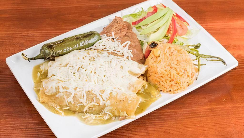 Enchiladas · (3) Corn tortillas stuffed with your choice. Topped with red, green or ranchero sauce. Served with rice, beans, salad and avocado.