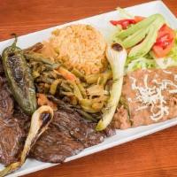 Carne Asada Con Nopalitos · Grilled tender skirt steak. Served with cactus slices, grilled jalapeno, grilled onions, ric...