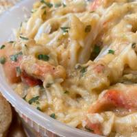 Cajun Crab Dip · Crab Legs Made into dip Topped with Cajun Seasonings Served with toasted French bread.