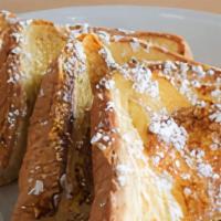 French Toast. · thick slices of texas toast battered in our signature dip and topped with powdered sugar. se...