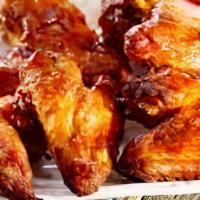 Roasted Chicken Wings · Cooked wing of a chicken coated in sauce or seasoning.