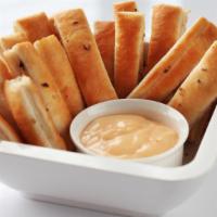 House Breadsticks · Freshly baked 16 piece breadstick made with butter, Italian seasoning and Romano cheese.