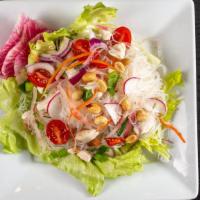 Yum Woon Sen (Chicken & Noodle Salad) · Gluten free. Spicy cellophane noodle salad with ground chicken, roasted peanuts, onion & cil...