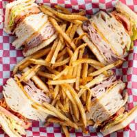Club Sandwich · Ham, turkey, bacon, lettuce, and tomato American and swiss cheese on toast.