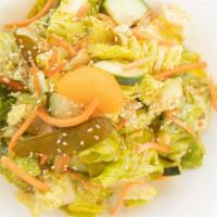 Large Zen Garden Salad · Romaine Hearts / Mandarin Oranges / Green Onions / Toasted Sesame Seeds / Cucumbers / Carrot...