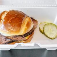 Beef Brisket · Our famous Texas-style brisket! Dry rubbed with our secret rub and slow smoked for hours ser...