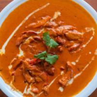 Butter Chicken · Clay oven baked chicken, tikka cooked in rich tomato butter cream.